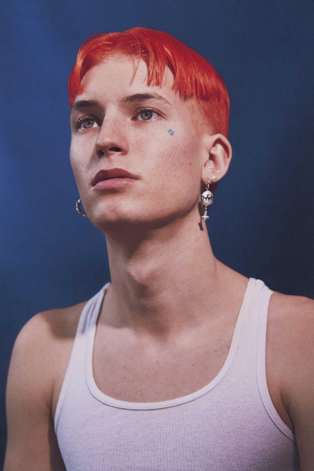 Gus Dapperton musician singer red haired man with earrings
